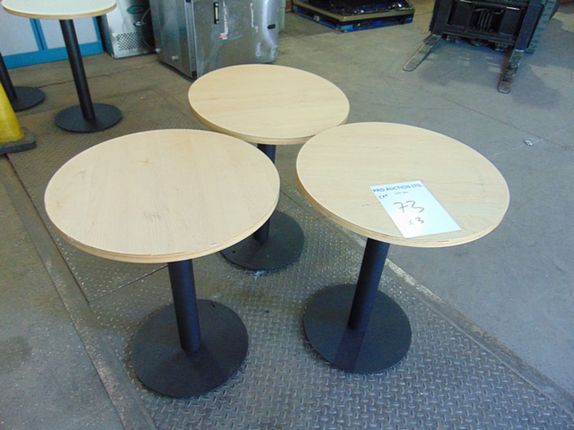 3 x Wooden round dinning tables with cast metal single base 600mm x 760mm