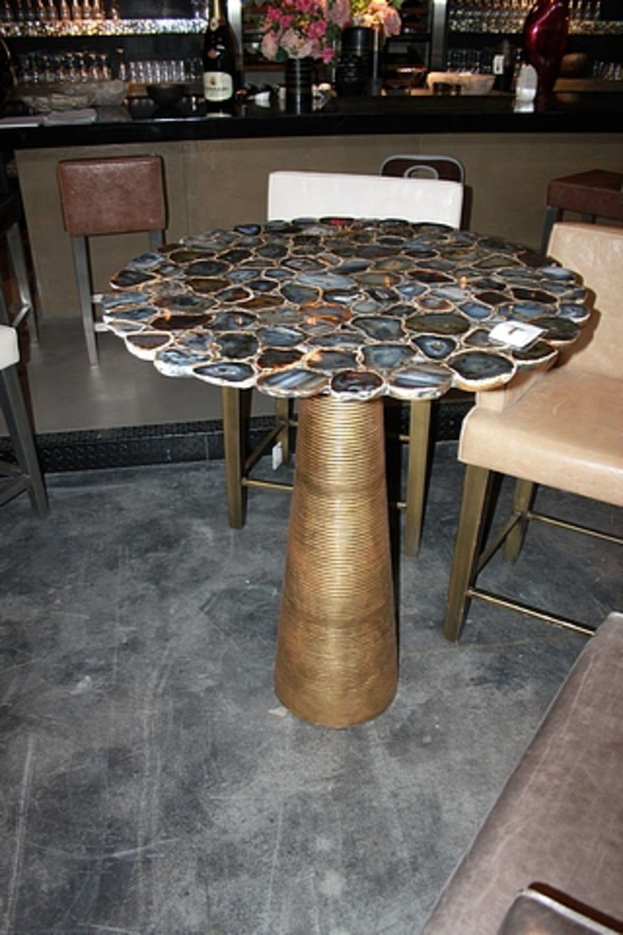 Bar table Rotate a polished black/natural agate round table with nickel-brass base variations in the