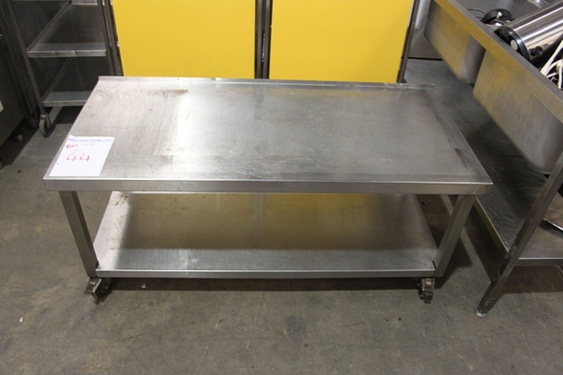 Stainless steel mobile table 1400mm x 650mm x 610mm