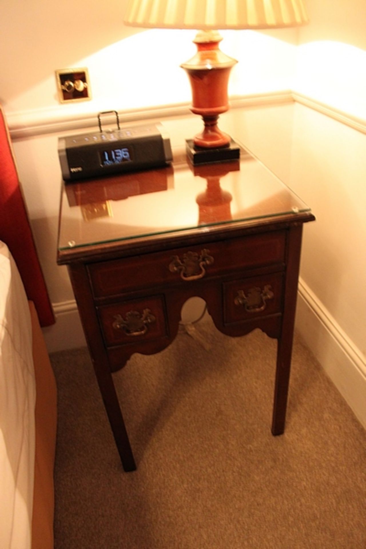 A Georgian style mahogany two drawer bedside table mounted on turned legs 500mm x 500mm