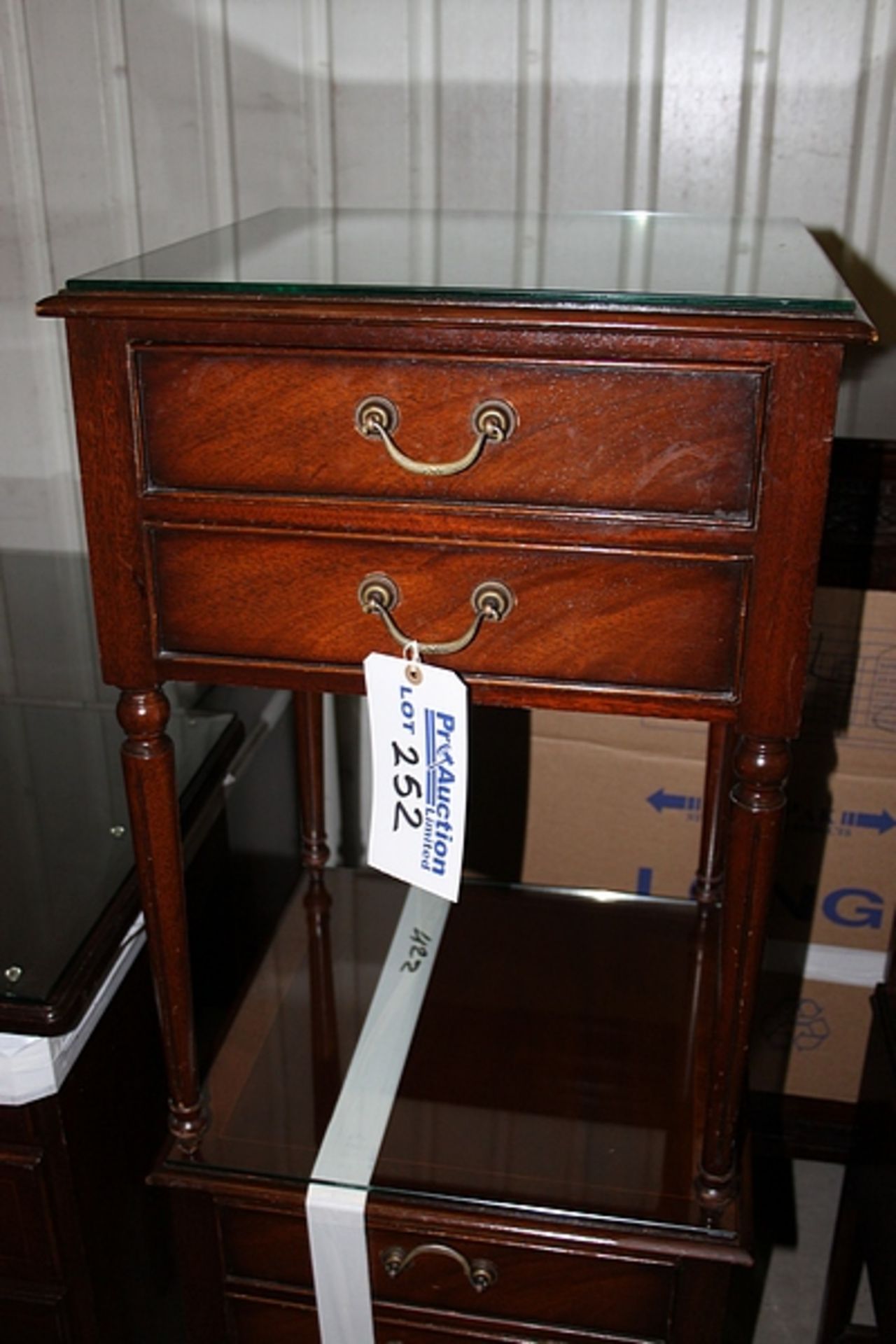 A Georgian style mahogany two drawer bedside table mounted on turned legs 500mm x 500mm