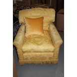 Armchair upholstered in a gold broccade fabric solid leg 700 x 800mm