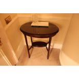 A pair of mahogany ovoid tables with low shelves 520mm x 360mm