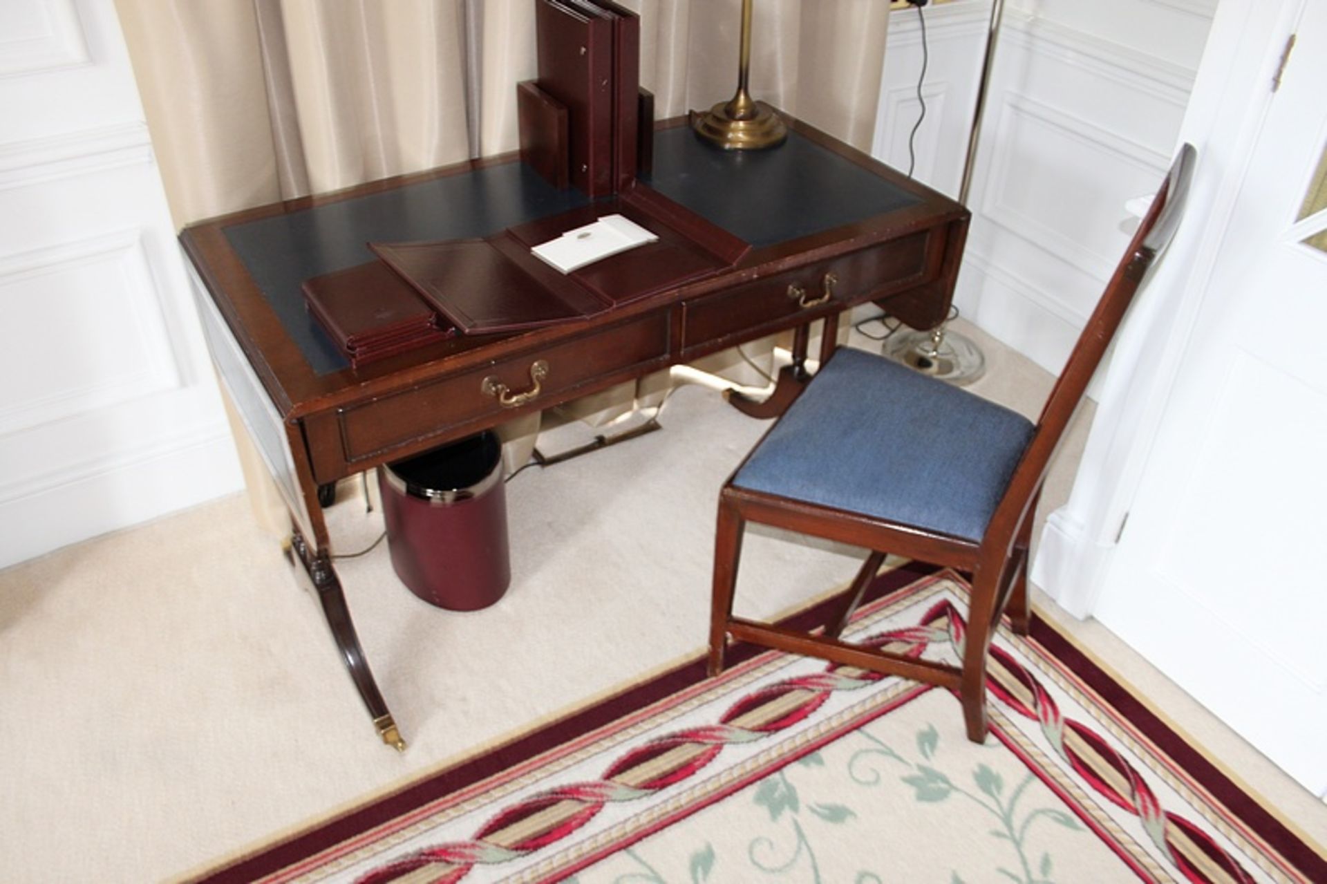 A Georgian style mahogany sofa writing table central frieze below inlaid leather top and drop down