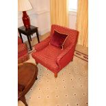 Armchair upholstered in red fabic with repeating red check pattern casters to front 700mm x 800mm