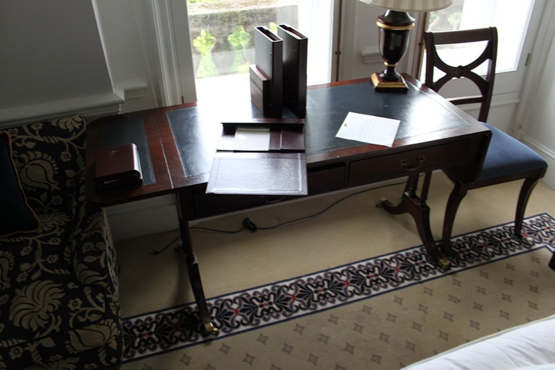 A Georgian style mahogany sofa writing tabletwo drawers below inlaid leather top and drop down sides