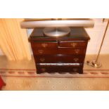 A Georgian style mahogany chest of drawers with three full and two half drawers on bracket plinth