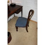 A mahogany wood Georgian style armchair upholstered in blue fabric