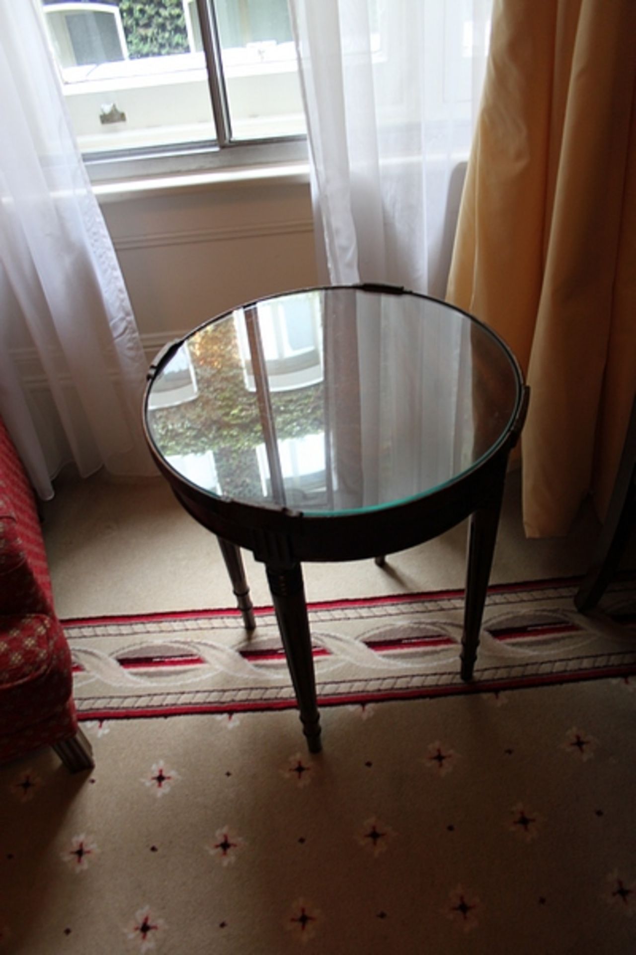 A mahogany circular occassional table the showw lipped top mounted on turned legs 490mm