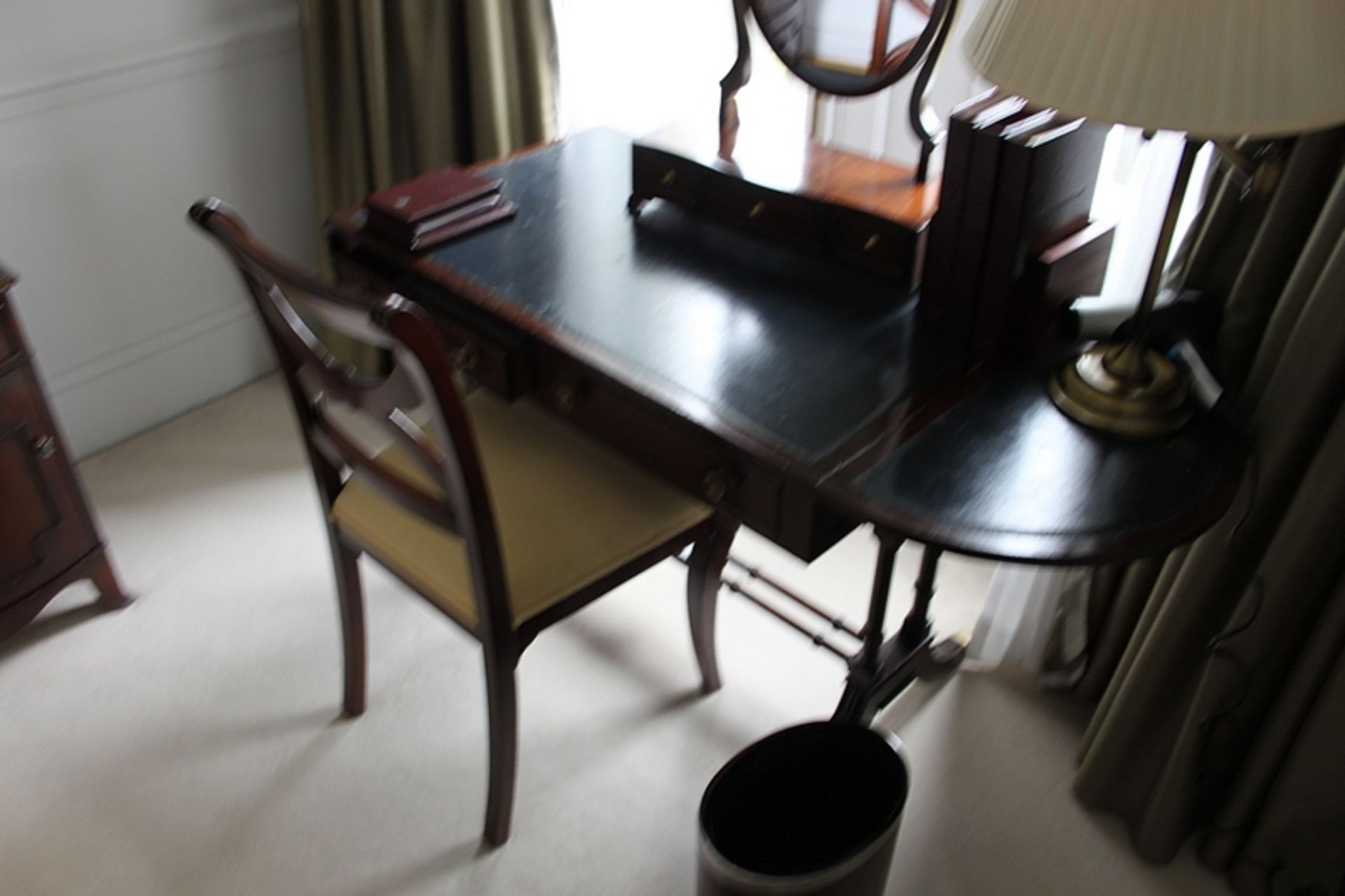 A Georgian style mahogany writing table frieze below inlaid leather top and drop down sides