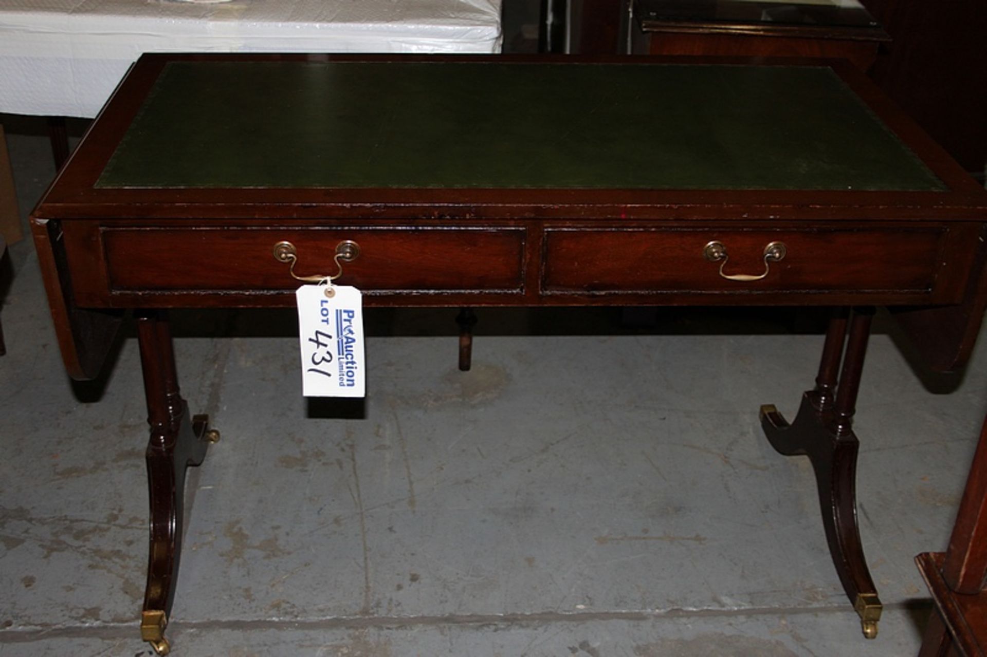 A Georgian style mahogany sofa writing table central frieze below inlaid leather top and drop down