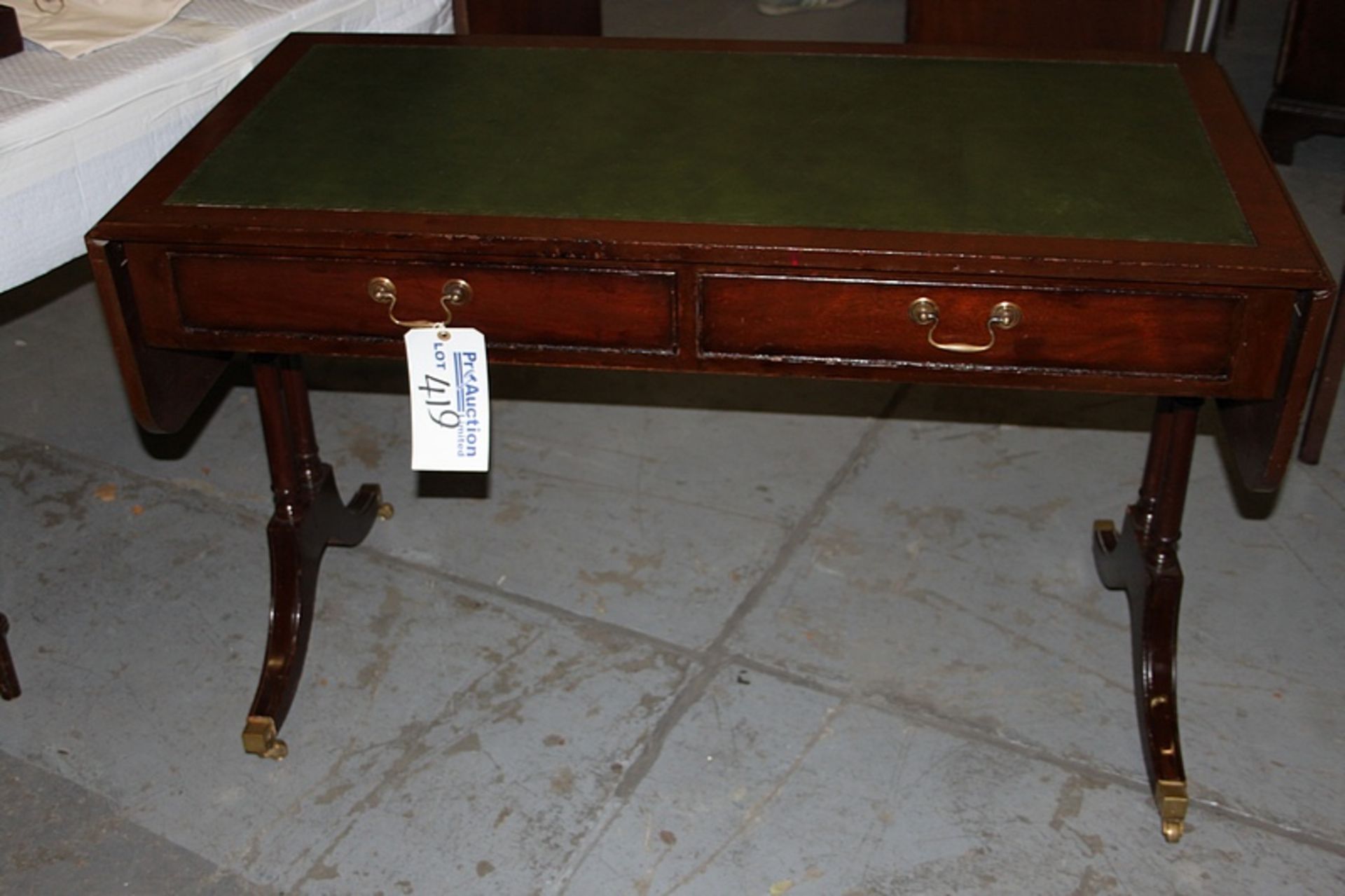 A Georgian style mahogany sofa writing table central frieze below inlaid leather top and drop down