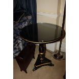 A pair of black and gilt japanned occasional table delicately painted with detailed Chinoiseries set