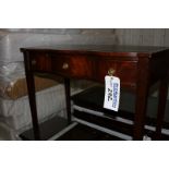 A mahogany Georigian style writing desk tooled leather inlay top bow fronted with three drawers