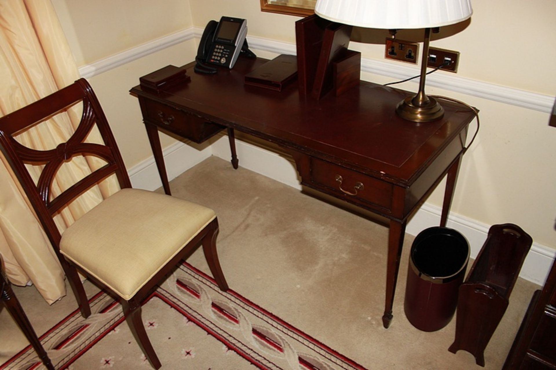 A mahogany free standing inlay writing desk kneehole with two graduated drawers to each side mounted
