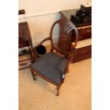 A mahogany side chair with a blue pad seat spoon back with splat back rest