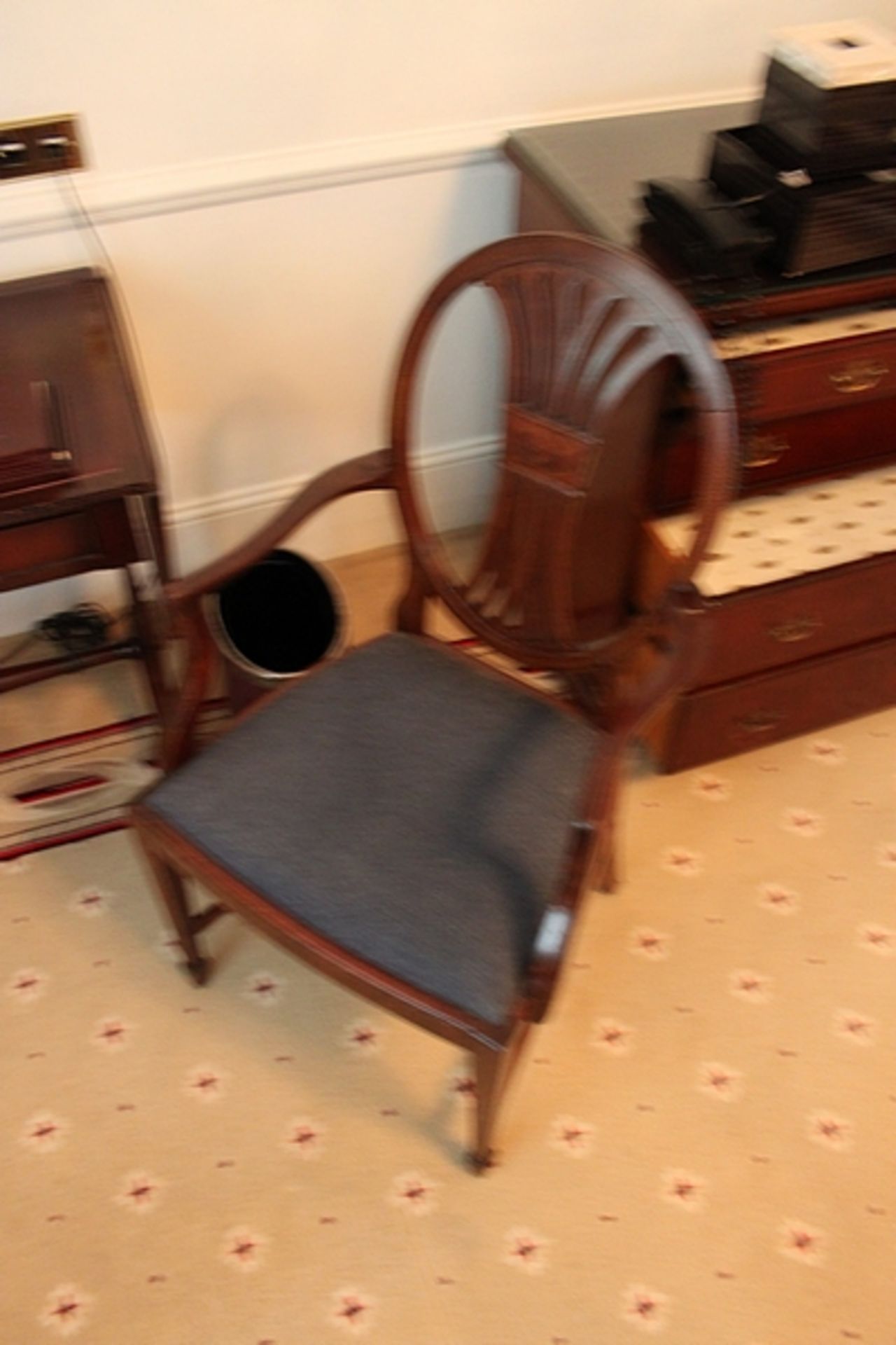 A mahogany side chair with a blue pad seat spoon back with splat back rest