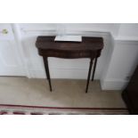 A mahogany demi lune console table mounted on turned legs 800mm x 330mm