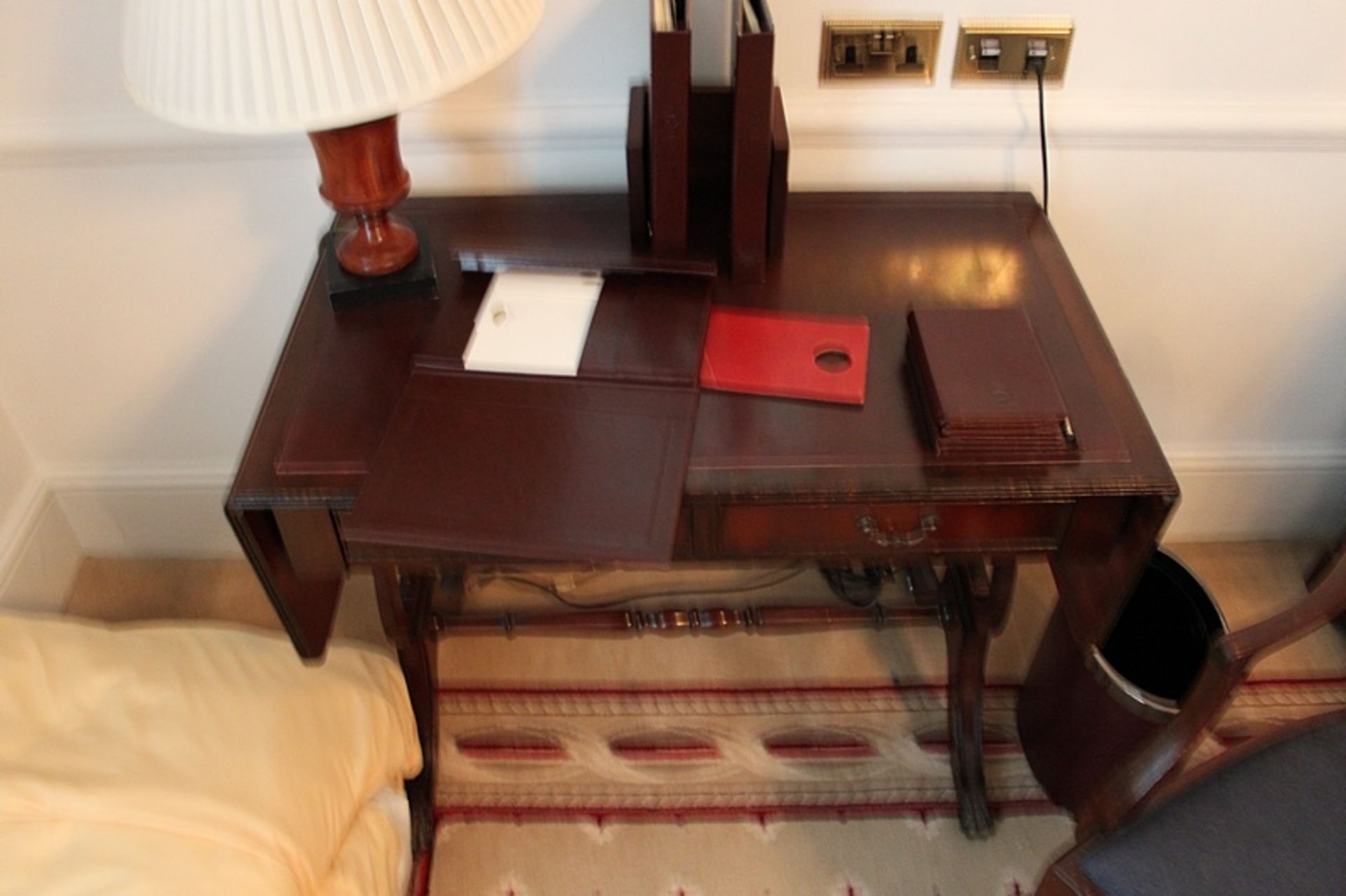 A Georgian style two drawer tooled leather top inlay writing table on square tapering legs 1350mm