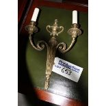 A pair of brass metal wall sconces