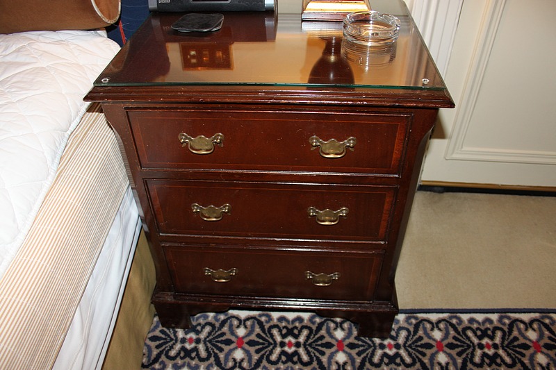 A pair of mahogany bedside cabinet chests in the Georgian style three drawers below, of dovetail