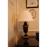 A pair of large polished wood urn shape table lamp and shade