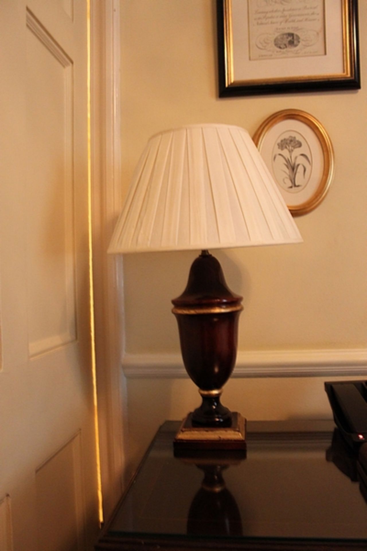 A pair of large polished wood urn shape table lamp and shade