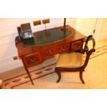 A Georgian style mahogany tooled inlay top writing table with central drawer flanked by graduating