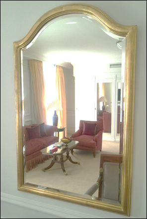 A Venetian arch shaped gilt colour framed wall mirror 900mm x 580mm