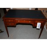 A Georgian style mahogany writing desk with tooled leather inlay top centre drawer flanked by two