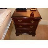 A mahogany bedside cabinet chests in the Georgian style three drawers below, of dovetail