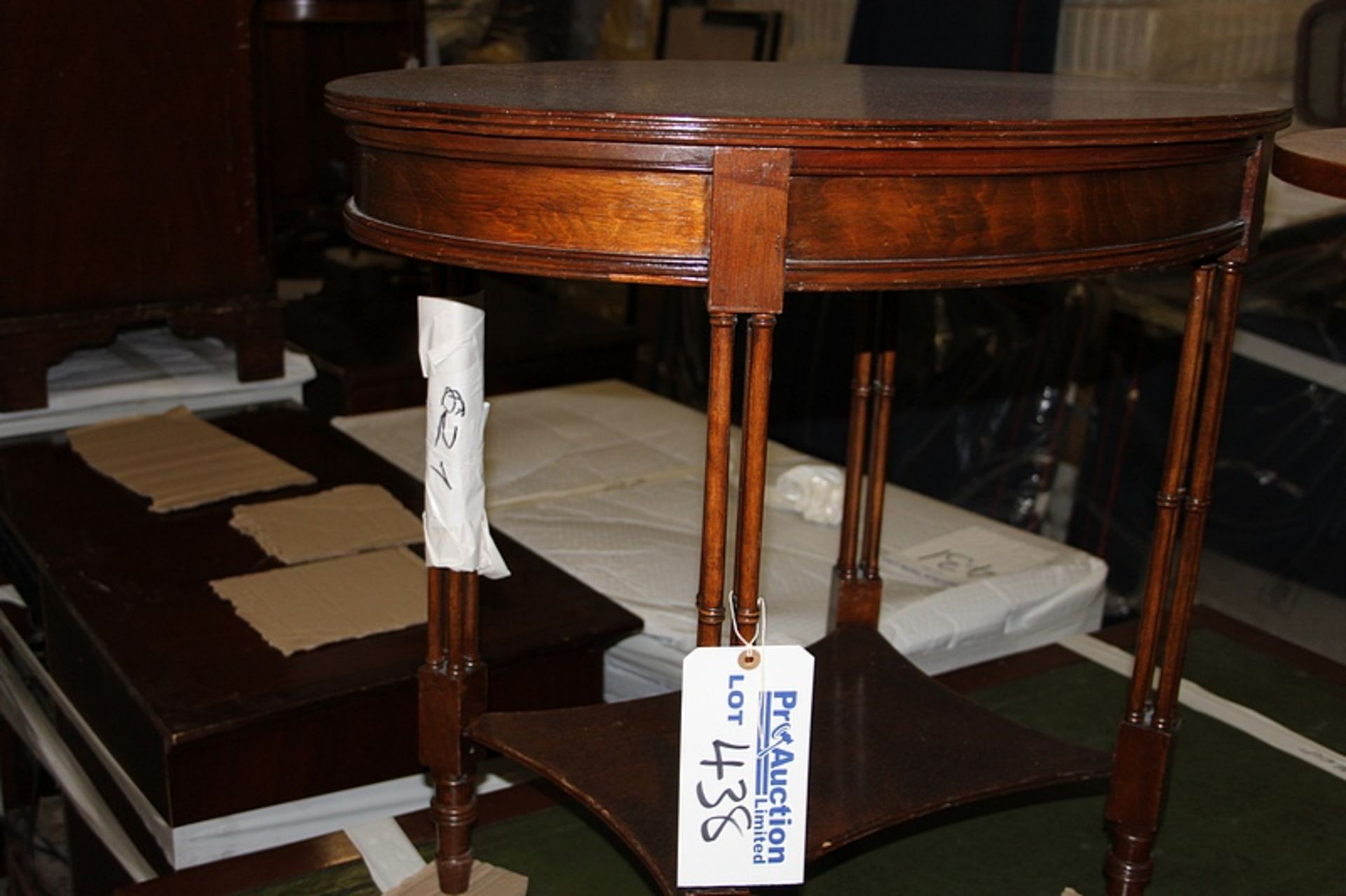 A Georgian style ovoid occassional table with ow stretcher shelf on squre spindle legs