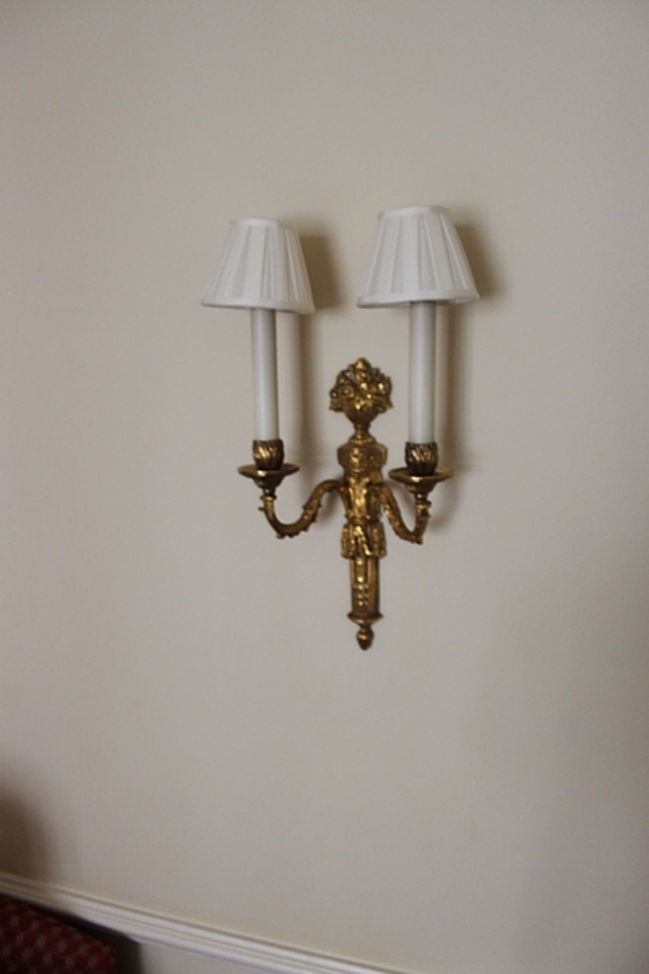 A pair of twin arm giltwood wall sconces