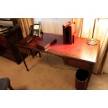 A mahogany Georgian style writing table featuring a leather top above two drawers supported by