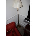 A florr standing lamp finished in brass 1350mm
