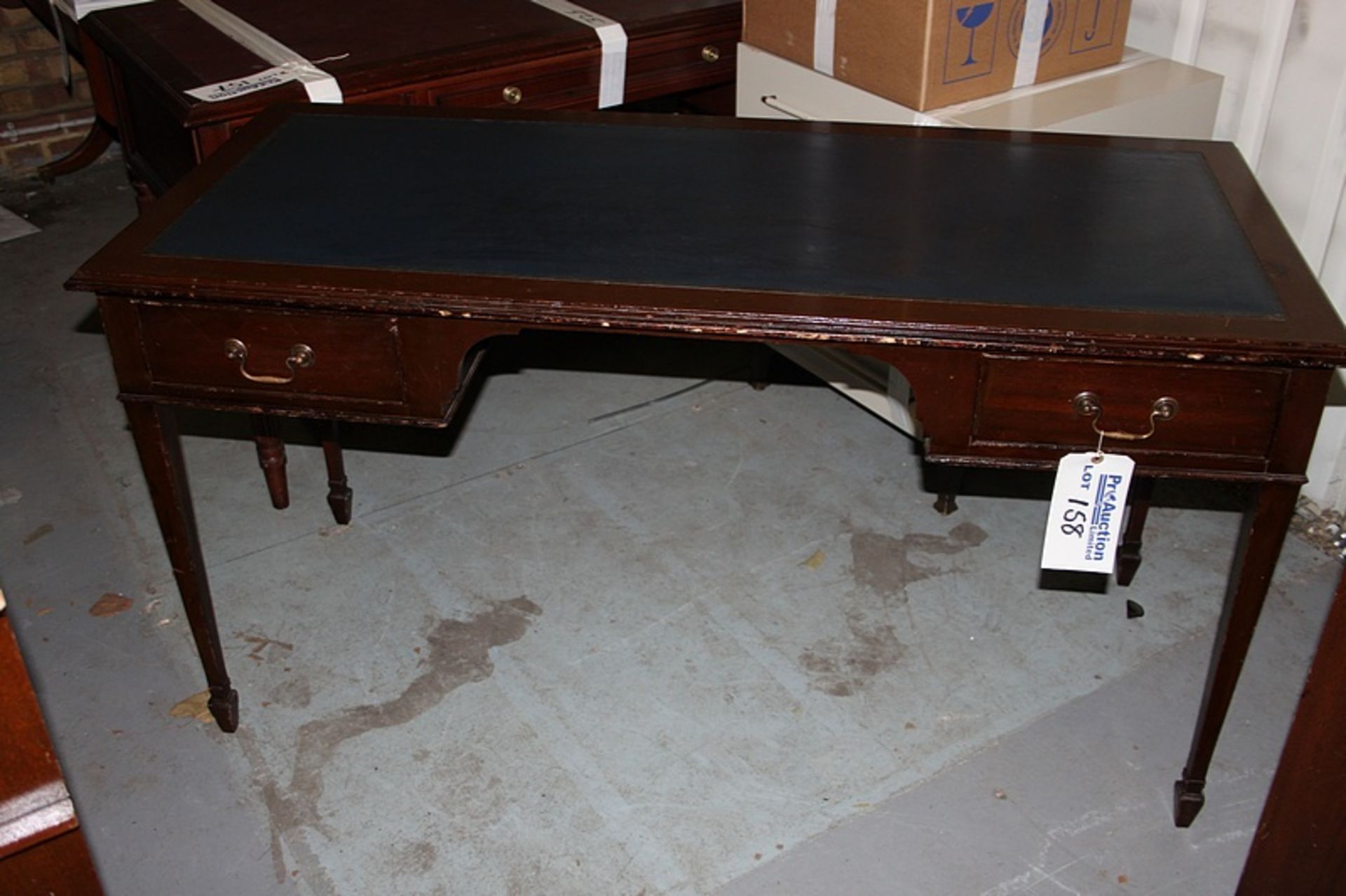 A mahogany free standing inlay writing desk kneehole with two graduated drawers to each side mounted