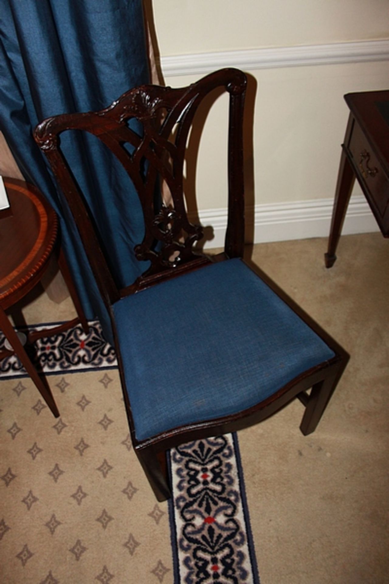 A Georgian stylside chair with bluw pad seat with intricate caarved back rest