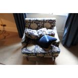 A pair of armchairs upholstered in blue fabric casters to front 700mm x 800mm