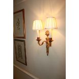 A pair of Georgian styled twin arm wall sconces