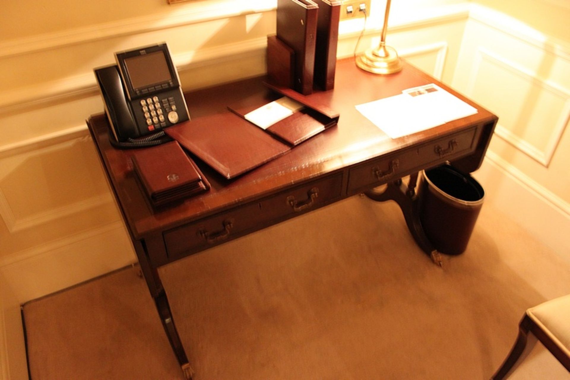 A Georgian style mahogany sofa writing table central frieze below inlaid leather top and drop down