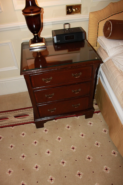 A pair of mahogany bedside cabinet chests in the Georgian style three drawers below, of dovetail