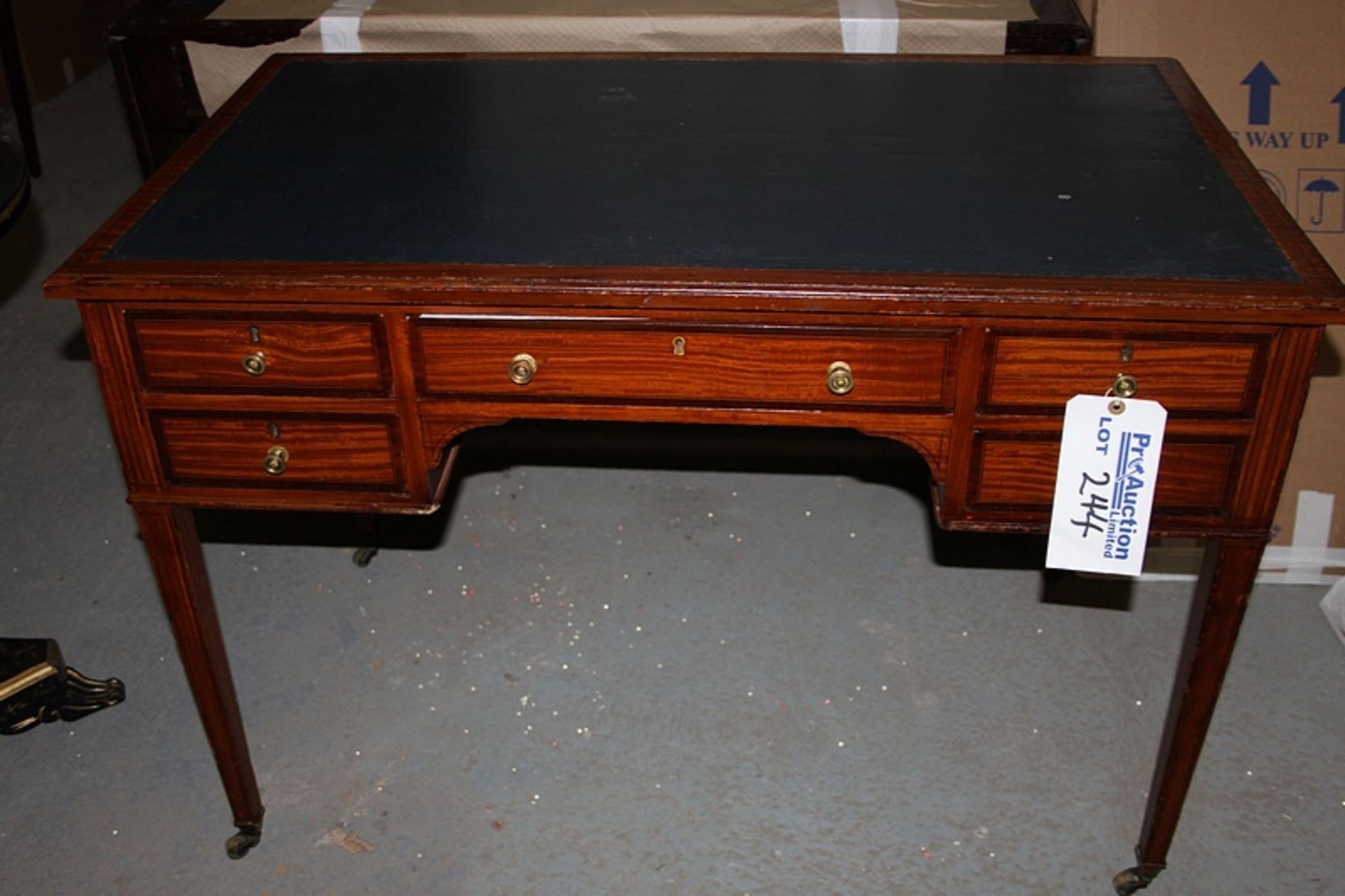 A Georgian style mahogany writing desk with tooled leather inlay top centre drawer flanked by two - Image 2 of 2