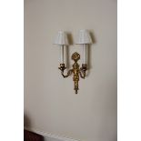 A pair of twin arm giltwood wall sconces