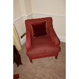 A pair of armchairs upholstered in red fabic with repeating red check pattern casters to front 700mm