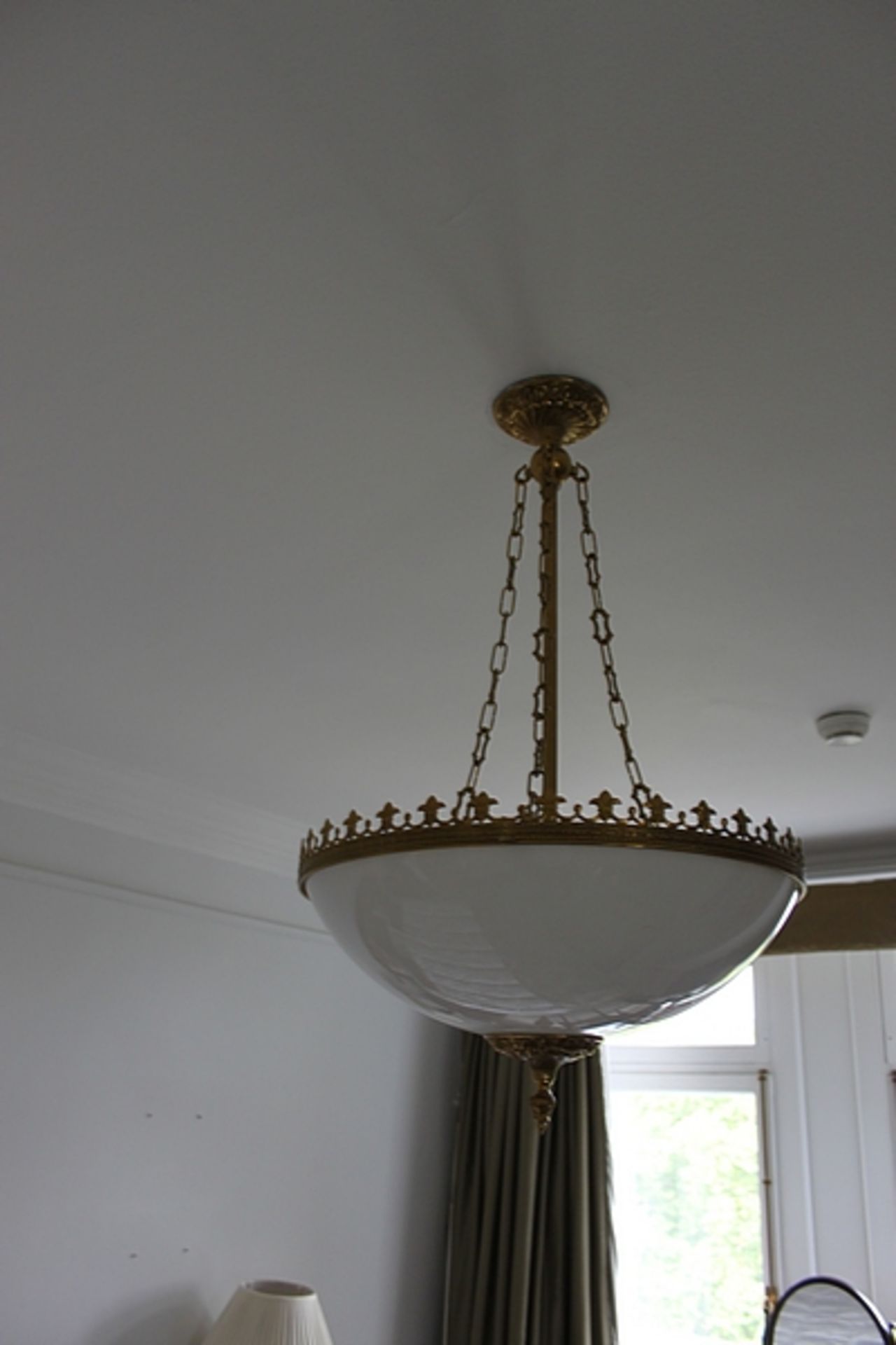 A glass hanging ceiling light