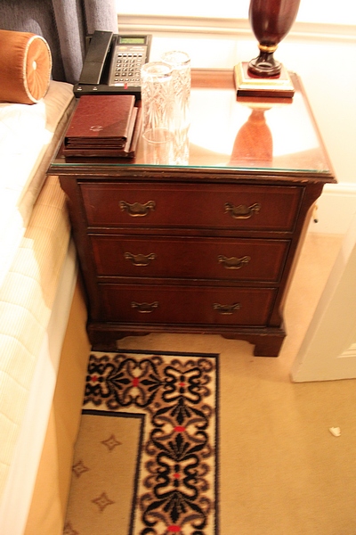 A pair of mahogany bedside cabinet chests in the Georgian style three drawers below, of dovetail