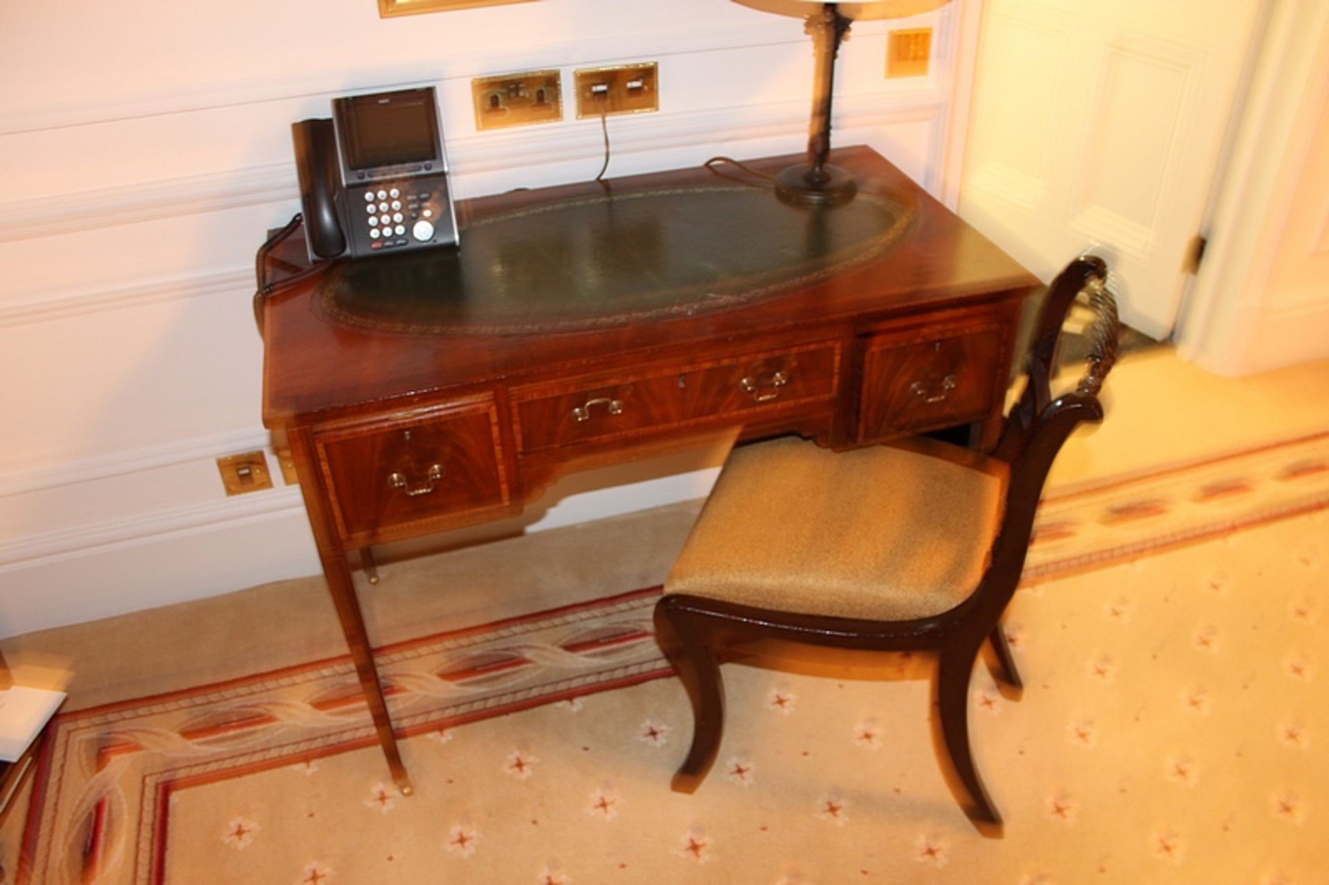 A mahogany wood Georgian style side chair upholstered in mustard fabric