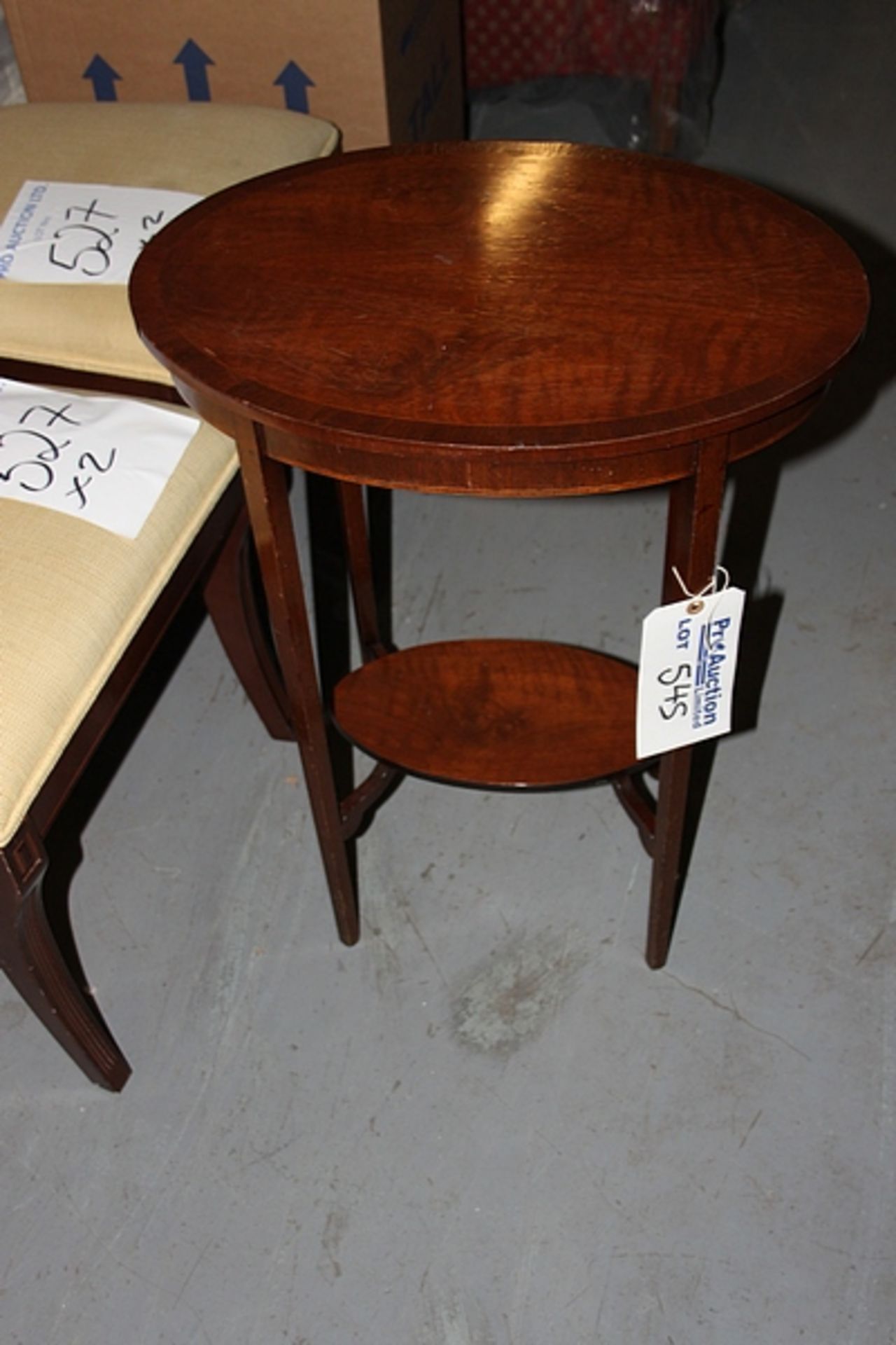 A mahogany ovoid table with low shelf 550mm x 350mm