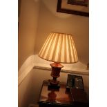 A pair of polished wood urn shape table lamps and shade 450mm