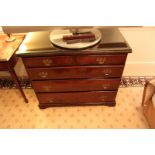 A Georgian style mahogany chest of drawers with three full and two half drawers on bracket plinth